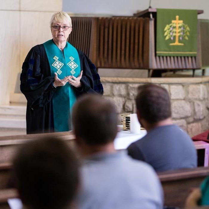 Students listen to faculty member in LTSS Chapel