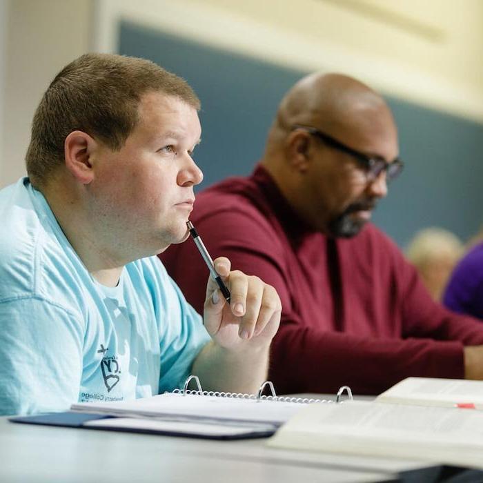 Two LTSS students listen to lecture in classroom